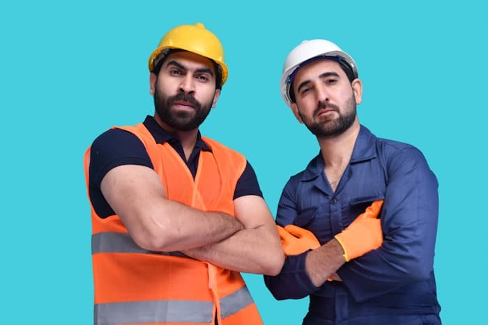 Construction professional reviewing supplier pricing on a building site.